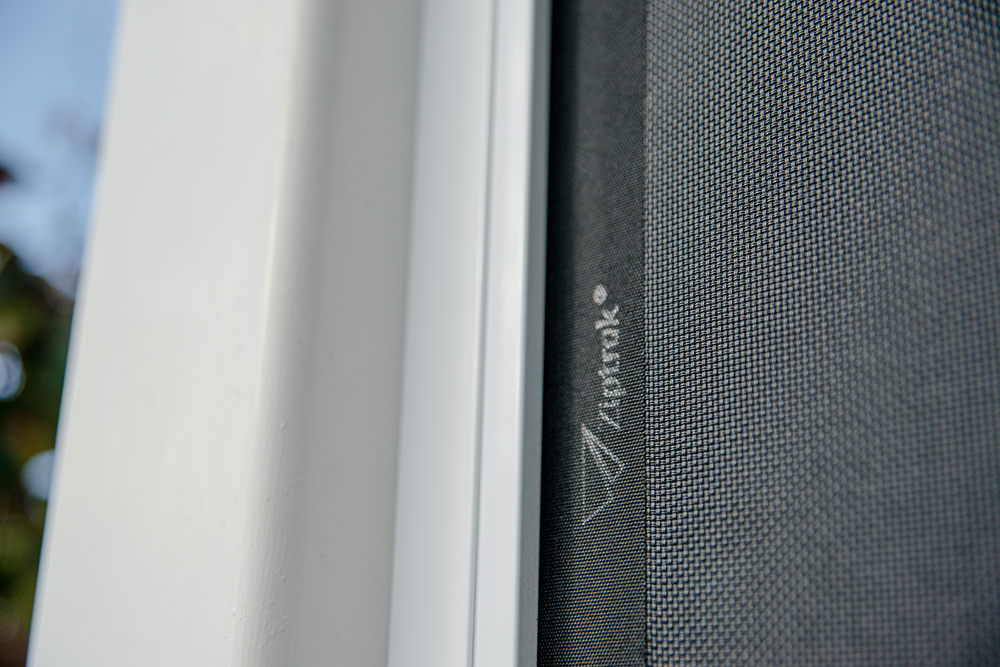 Close-up of Ziptrak logo on outdoor blind fabric