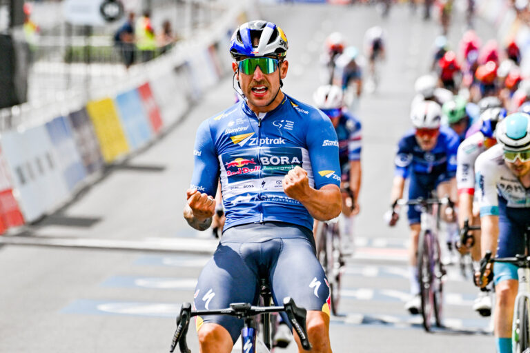 Sam Welsford celebrating the winning of the Tour Down Under 2025 wearing a Ziptrak sponsor kit.
